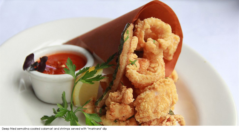 Deep fried semolina coated calamari and shrimps served with 