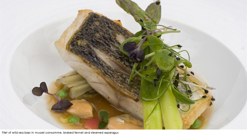 Filet of wild sea bass in mussel consomme, braised fennel and steamed asparagus